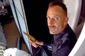 This was the moment arsonist, Martin Foley, spat in the face of a police officer as he was being rescued from a burning roof. 