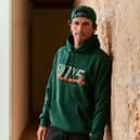 Formula 1 star Carlos Sainz is taking his style off the track with a brand-new fashion collaboration with New Era