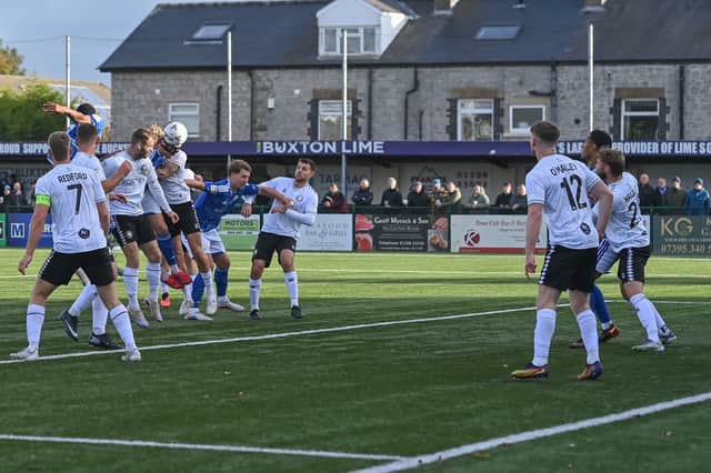 Kieran Burton heads home Buxton's first goal against Worksop Town