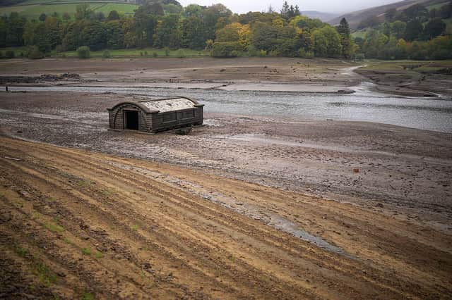 The exposed pump house for the lost Derbyshire village of Derwent is revealed due to the low water level at Ladybower Reservoir. Photo by Christopher Furlong/Getty Images.