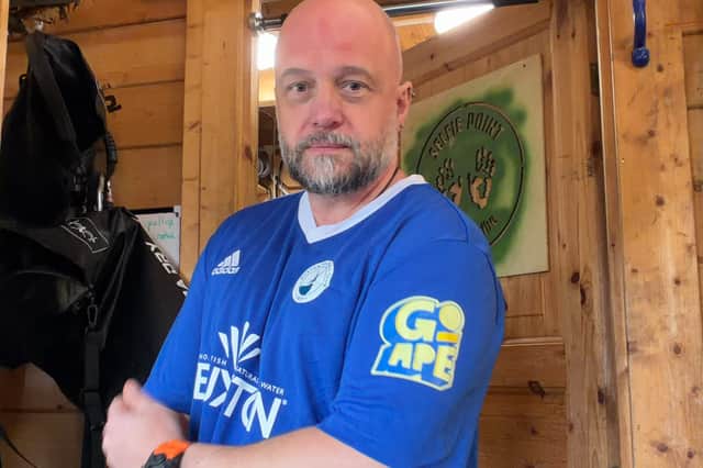 Go Ape Buxton Commercial Site Manager John Wakeham models the Buxton Ladies Football Team home kit, featuring the Go Ape sleeve sponsorship.