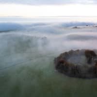 Stunning image captures misty dawn breaking over ancient circle in Derbyshire's Peak District