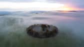 A misty dawn breaks over Minninglow in the Peak District