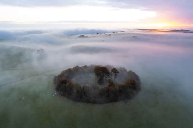 A misty dawn breaks over Minninglow in the Peak District
