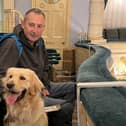 A guide dog puppy and their Puppy Raiser at Buxton Opera House.