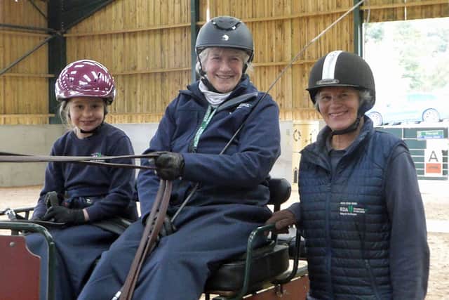 Happy smiles from (l-r) junior carriage driver Chloe, Jo Taylor and Clare Cox after a dazzling carriage driving display