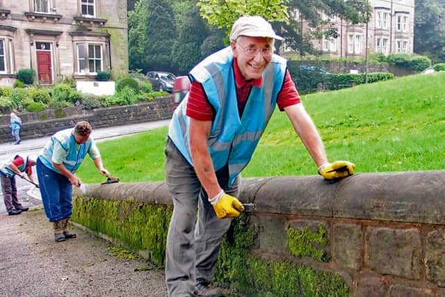Phil Sutton cleaning, with Jim Lowe behind