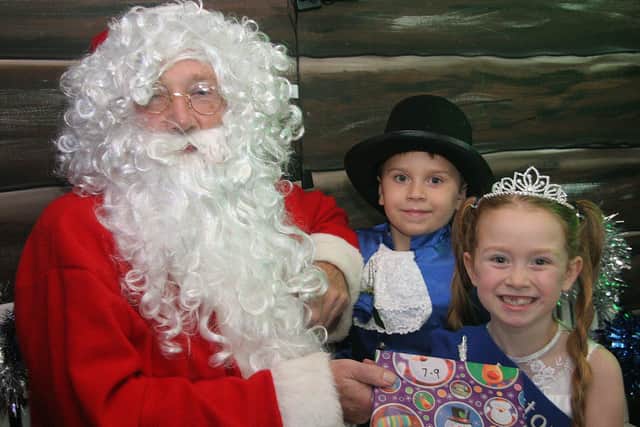 Buxton Dickensian market -  Father Christmas with Leo and Mia Hobson