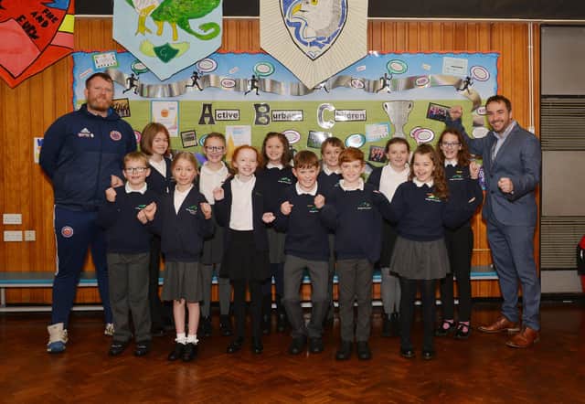 Burbage Primary School are fundraising for a new multi-use sports pitch, pictured is headteacher Anthony Teirney and sports coach Chris Hill with school house captains