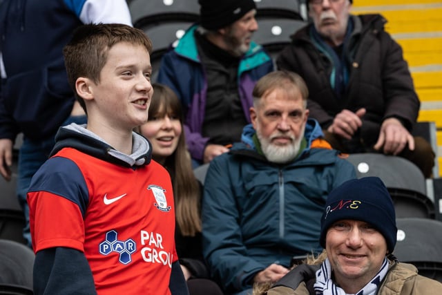 A young North End fan decked out in the red away shirt at Hull