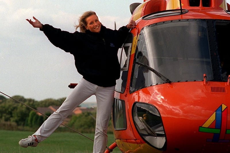 Weather presenter Denise van Outen is pictured with the orange Big Breakfast helicopter after landing at Leeds Bradford Airport.