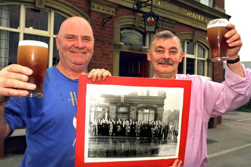 Leon Parrish (left) at The Sun pub in Hunslet with landlord Barry Franks with a group photograph taken in 1947. They were trying to trace a mystery boy in the picture... to buy him a pint.