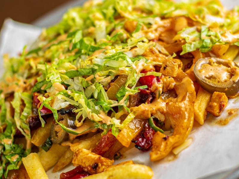 Dirty fries topped with mozzarella at Grizzlers