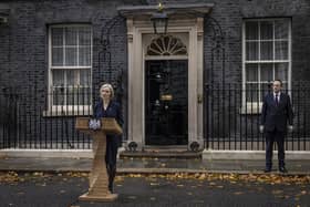 Liz Truss speaks outside 10 Downing Street, with husband Hugh O'Leary, as she resigns as Prime Minister. (Photo by Dan Kitwood/Getty Images)