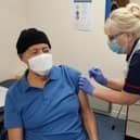 Thornbrook Nurse Trisha Longden gives the first vaccine in January