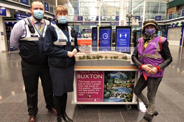Friends of Buxton Station secretary Sue Mellor, right, promoting the town to visitors at Manchester Piccadilly sation.