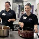 Marie Carmon and Sophie Jepson serve up a community meal at YMCA Derbyshire