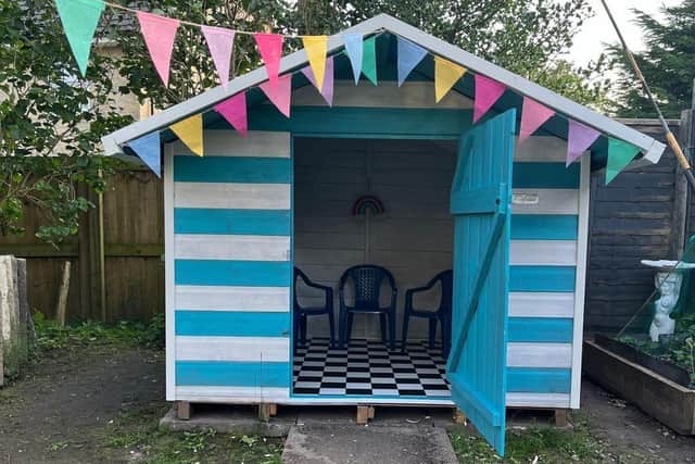 Kate Jenkins, from Buxton, with her Beach Hut at the Bottom of the Garden, is delighted to have made it to the final of the Shed of The Year Awards. Photo submitted