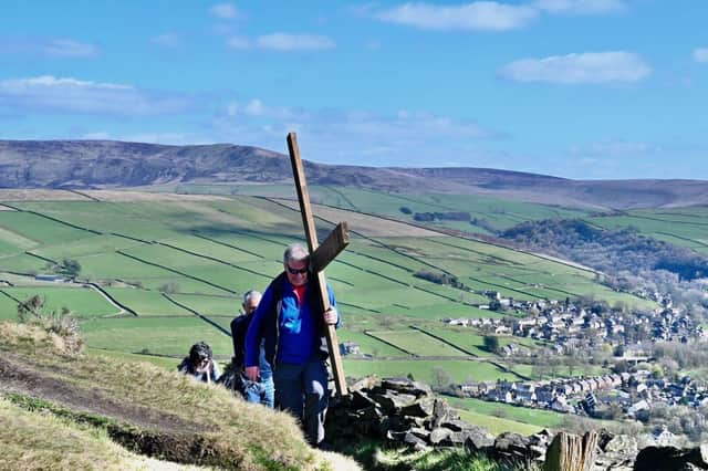 A cross is carried from Hayfield to be erected at the top of Lantern Pike as a celebration in preparation for Good Friday.