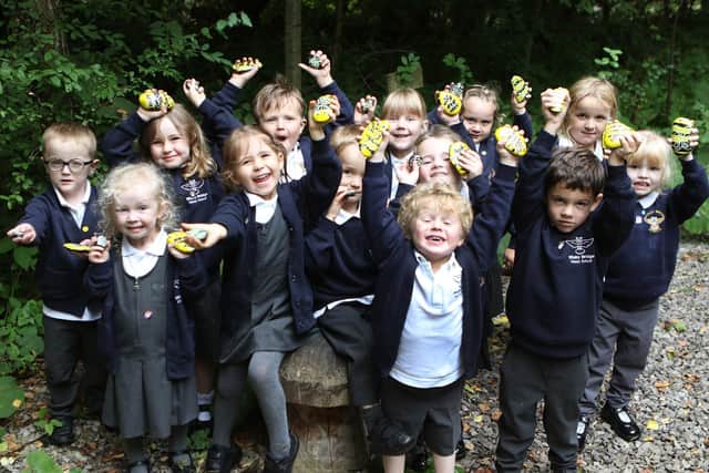 Reception pupils from Whaley Bridge Primary set off to hide their bees around the village