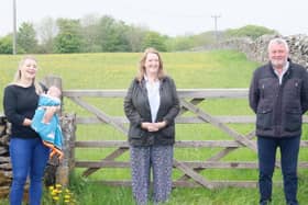 From left, Foolow Wildwood committee member Katie Edwards and baby Lottie, Sarah Dines MP, and Councillor Alasdair Sutton.