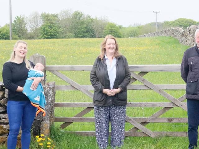 From left, Foolow Wildwood committee member Katie Edwards and baby Lottie, Sarah Dines MP, and Councillor Alasdair Sutton.