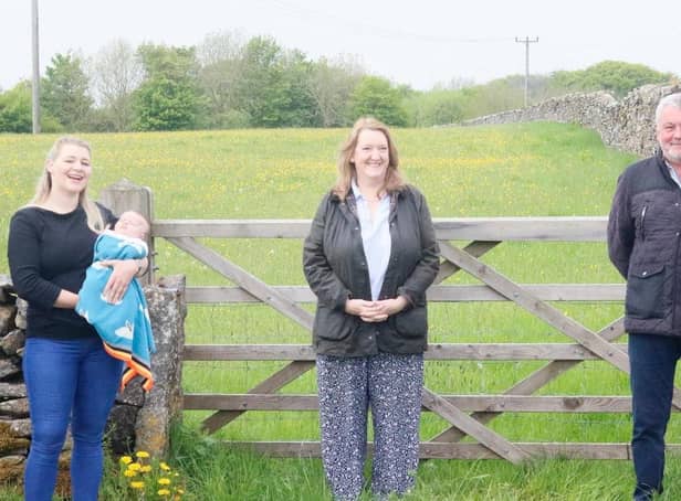 From left, Foolow Wildwood committee member Katie Edwards and baby Lottie, Sarah Dines MP, and Councillor Alasdair Sutton.