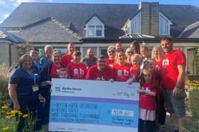 Steve Gregory's family who walked from Buxton to Old Trafford to raise funds for Blythe House in his memory pictured presented the cheque to the charity. Pic submitted