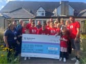 Steve Gregory's family who walked from Buxton to Old Trafford to raise funds for Blythe House in his memory pictured presented the cheque to the charity. Pic submitted