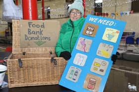 Whaley Bridge Food Bank has a donation point in the warehouse with a board that flags their current requirements. Pictured is volunteer Jan Clay