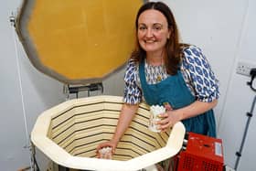 First look at Buxton pottery painting in the Cavendish arcade, Buxton. Leanne  Lawler taking fired pots out the kiln. Photo Brian Eyre