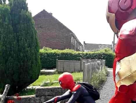 Stockport Spiderman inspects a garden