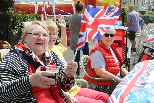 Flag waving at the Lathkill Grove street party for the Platinum Jubilee