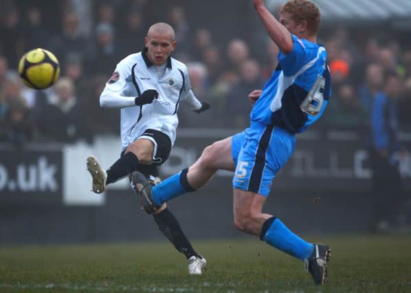 Lindon Meikle scores against Wycombe Wanderers in 2008.