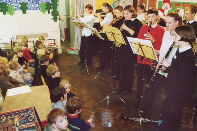 New Mills School's musicians playing a Christmas concert at the Nursery School in 2000.