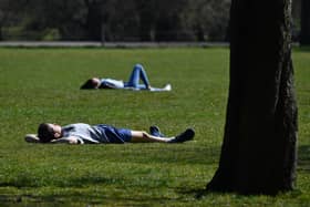 The warm Easter weather saw people tempted to the county's parks to sunbathe. Photo: Ben Stansall/Getty Images