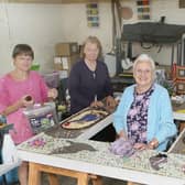 Whaley Bridge's well dressers at work on one of this week's displays, Toni Williams, Jill Malzard, Janet Brierley and Diane Beever. Pic Jason Chadwick