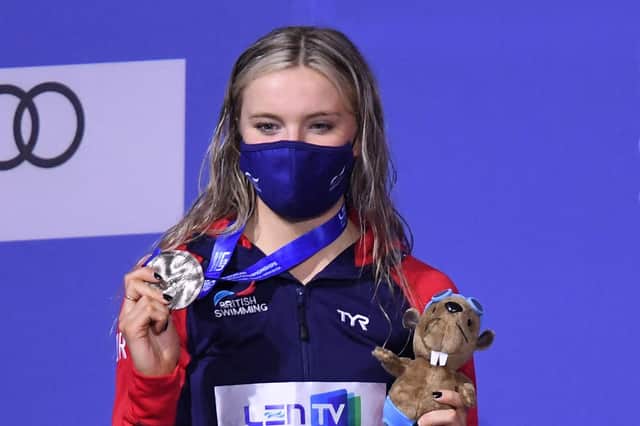 Abbie Wood poses on the podium after the final of the women's 200m individual medley at the LEN European Aquatics Championships at the Duna Arena in Budapest. (Photo by ATTILA KISBENEDEK/AFP via Getty Images)