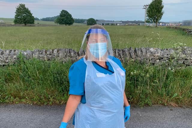 Hospice at Home healthcare assistant Hayley Spencer from Buxton is photographed wearing full PPE during one of her shifts