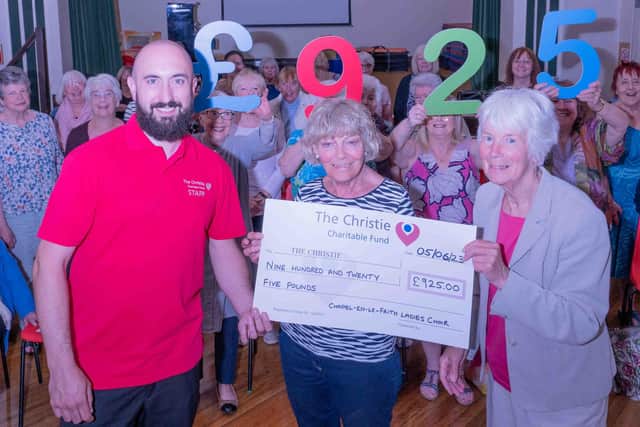 Christie fundraising worker Adam George with the Chapel-en-le-Frith Ladies’ Choir