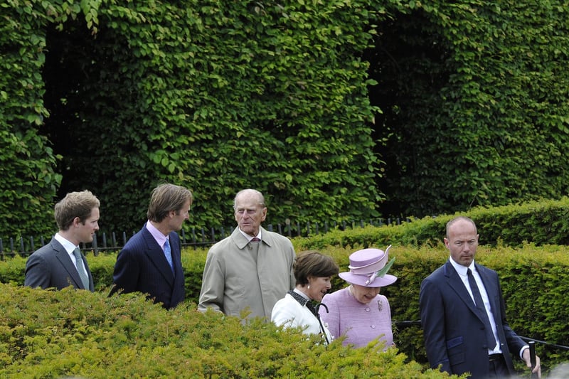 The Royal party walks through The Alnwick Garden.