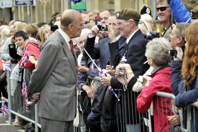 The Duke of Edinburgh chats to 85-year-old George Davidson, a former Coldstream Guardsman, from Warkworth.