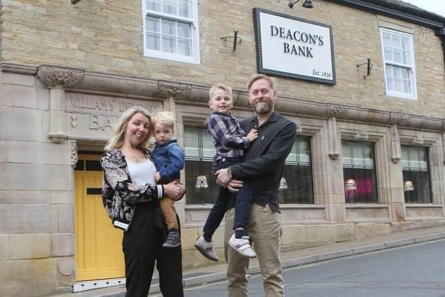 Deacon's Bank owner Tom Gouldburn reflects on his success since opening, pictured with his wife Bex and sons Harry and Oscar. Photo Jason Chadwick
