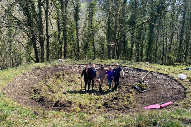 Some of the members before they had cleared a limestone reservoir on the land at Cressbrook Dale