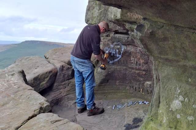 Some of the graffiti was dated to this summer. (Photo: Peak District National Park Authority)