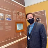 Scott Russell, the Trust's education development manager, at a timeline of the Crescent's history