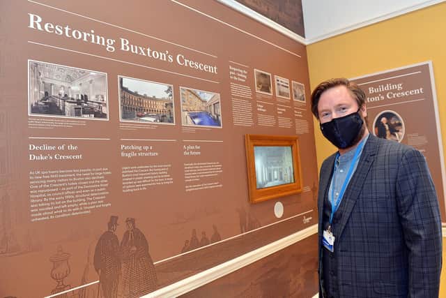 Scott Russell, the Trust's education development manager, at a timeline of the Crescent's history
