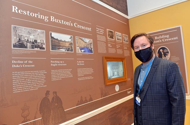 Scott Russell, the Trust's education development manager, at a timeline of the Crescent's history