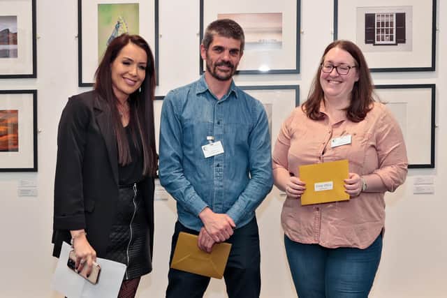 Sarah Lind, right, collects her prize.