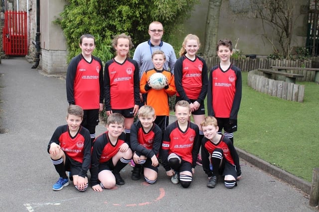 Buxworth Primary School pupils Georgie Garner, Lucy Allott, Ethan Moore, Evie Wilde, Louis Ecob, Tom Pollard, Henry Batt, Cavan Bowden, Dylan Moore and Finlay Rodgers model the new sports kit whihc has been sponsored by J S Burgess Engineering of Whaley Bridge